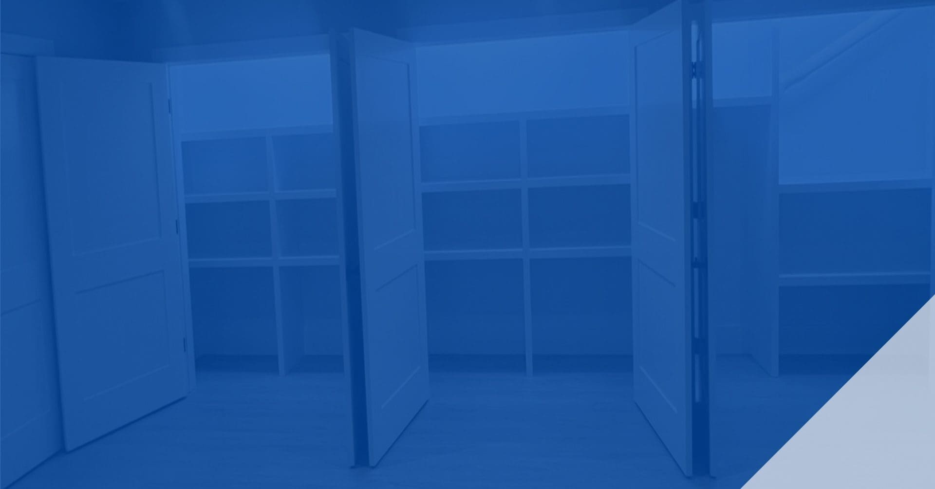 Empty glass display cases in a dimly lit room.